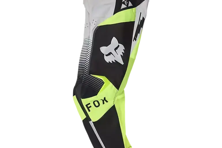 Fox 180 Collect Motocross Hose für Jugendliche in Schwarz, Weiß und Neon-Gelb, Seitenansicht, mit Fox-Logo.