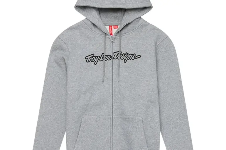 Grauer Zip Up Hoodie Signature Grey Heather von Troy Lee Designs, mit durchgehendem Reißverschluss und Logo auf der Brust