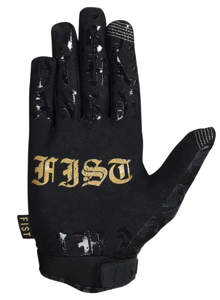 Schwarzer FIST Handwear Hang On Handschuh mit goldener Aufschrift, flach von oben fotografiert