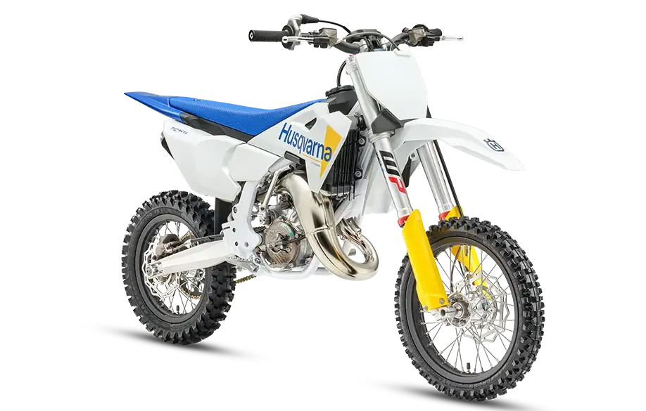 Husqvarna TC 65 2027 Kinder-Motocross-Motorrad in weiß-blau-gelb mit Stollenreifen, Seitenansicht