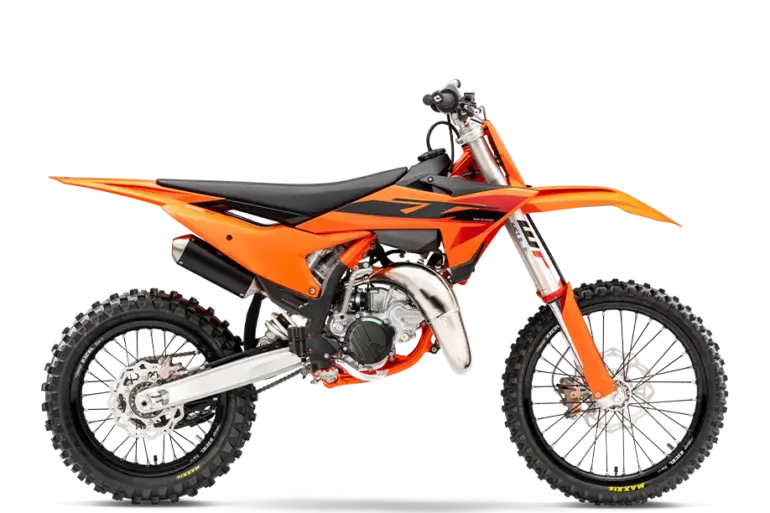 Seitenansicht der KTM 85 SX 19/16 2026, ein modernes Jugend-Motocross-Motorrad in Orange.