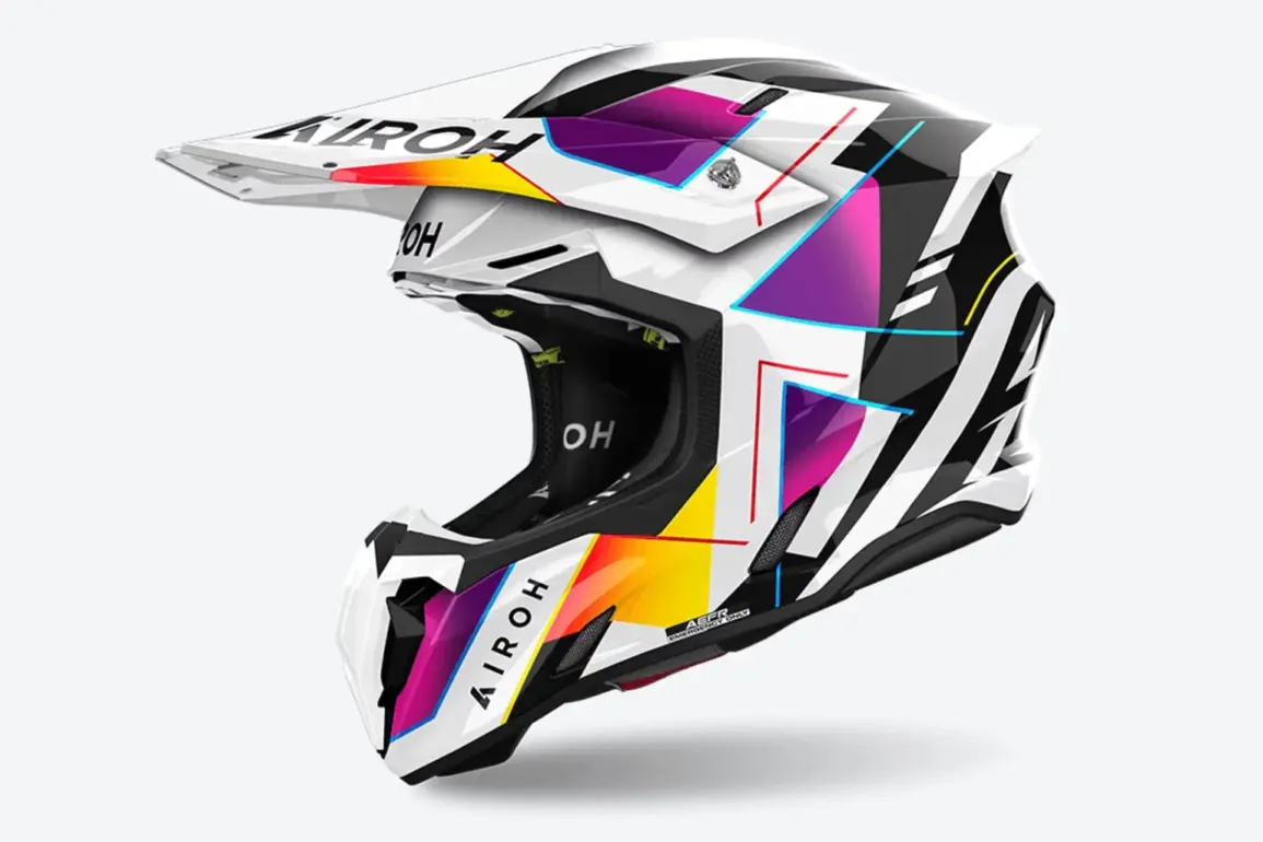 Airoh TWIST 3 RAINBOW Offroad-Helm mit buntem, geometrischem Design in Weiß, Schwarz, Gelb, Lila und Rot, Seitenansicht.