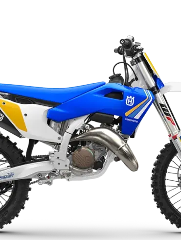 Motocross-Motorrad Husqvarna TC 125 Heritage 2025 mit blau-gelbem Design, Seitenansicht.