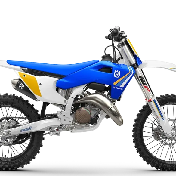 Motocross-Motorrad Husqvarna TC 125 Heritage 2025 mit blau-gelbem Design, Seitenansicht.