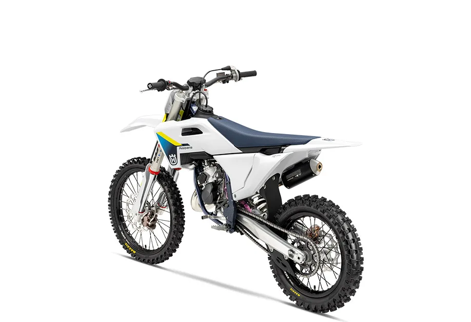 Husqvarna TC 85 19/16 2026 Motocross-Motorrad seitlich fotografiert, weiß-blaues Design, Offroad-Bereifung, schlanke Ergonomie, Sportfederung.