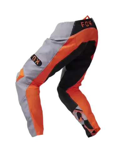 FOX 180 Emotion Crosshose in orange-grauer Farbkombination mit schwarzen Akzenten, seitliche Ansicht.