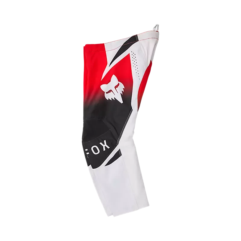 Seitenansicht der FOX Kids 180 Shield Motocross-Hose in Rot, Weiß und Schwarz mit markantem Fuchs-Logo, speziell für Kinder entwickelt.