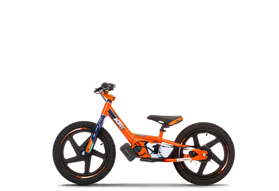 KTM SX-E 1.16 Kinder-Elektro-Balance-Bike in Orange, Seitenansicht auf weißem Hintergrund