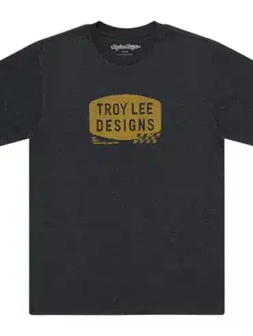 Schwarzes Troy Lee Designs T-Shirt mit kleinem, goldfarbenem Stamp-Logo auf der Vorderseite.