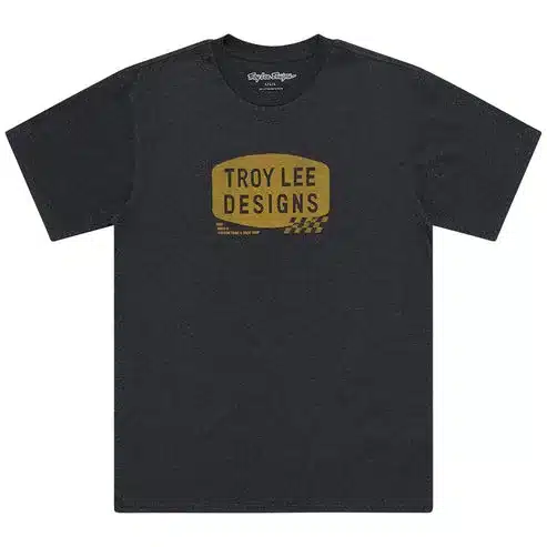Schwarzes Troy Lee Designs T-Shirt mit kleinem, goldfarbenem Stamp-Logo auf der Vorderseite.