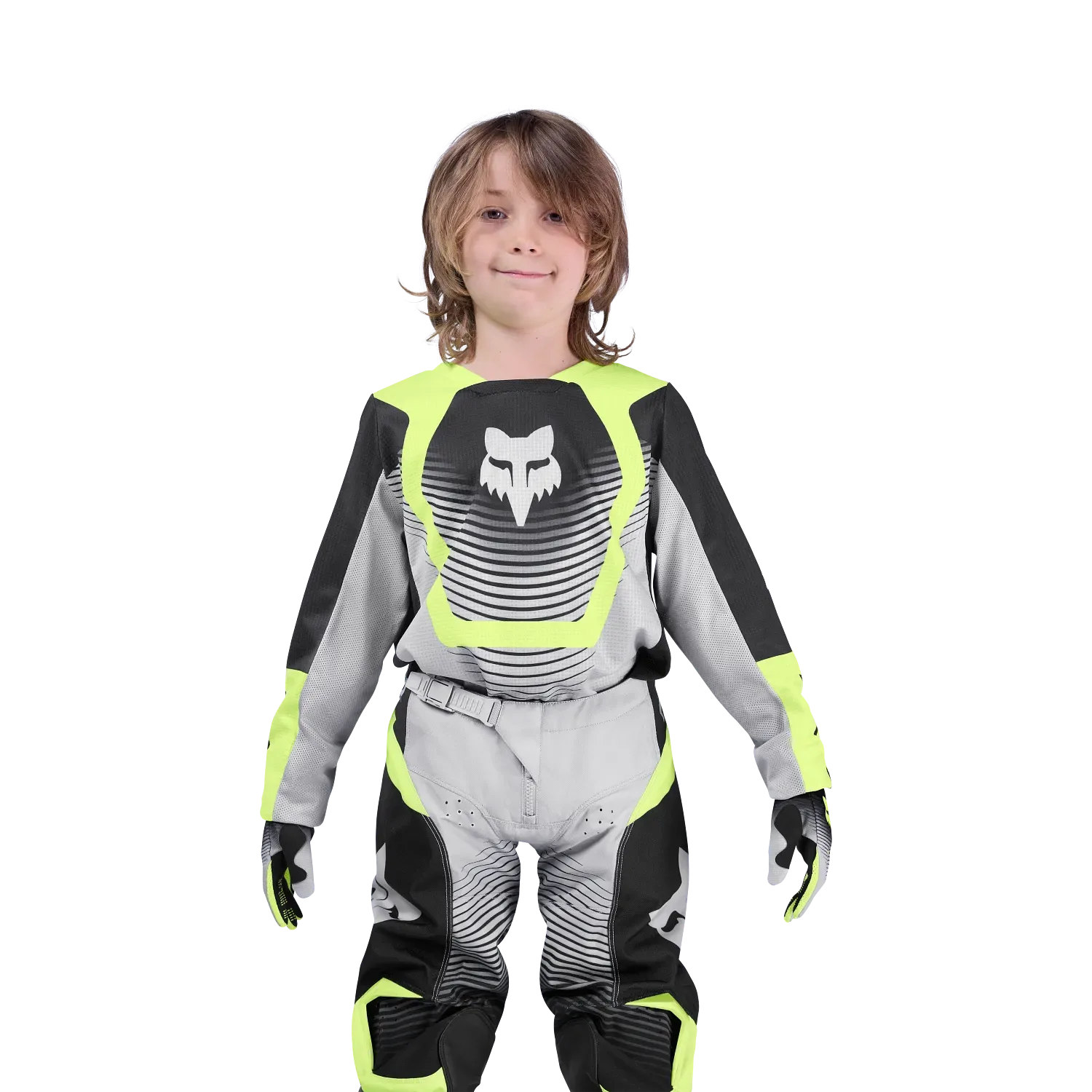 Junger Motocross-Fahrer im Fox 180 Collect Jersey in Grau und Gelb mit schwarzen Details