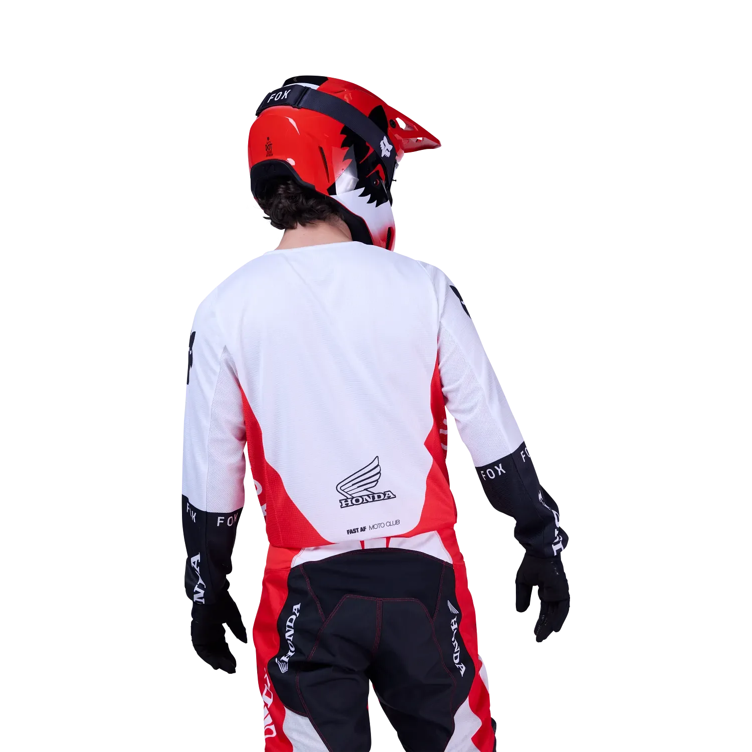 Motocross-Fahrer trägt das Fox 180 Honda Trikot von hinten, mit rotem Helm und passender Hose.