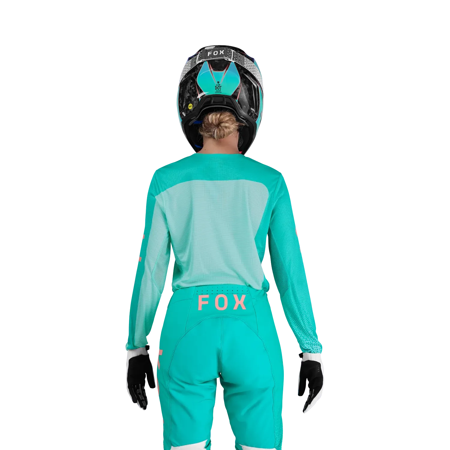 Rückseite eines leichten, türkisfarbenen Motocross-Trikots für Frauen mit FOX-Logo, getragen von einer Fahrerin mit Helm.