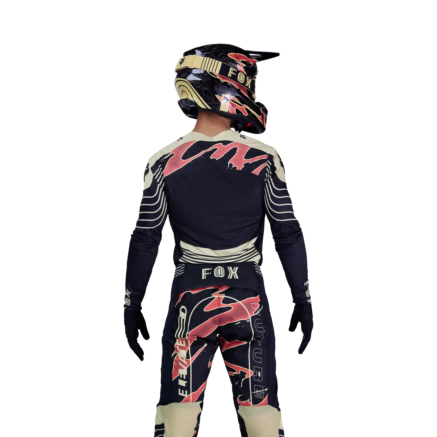 Motocross-Fahrer von hinten im Flexair Inning Jersey von Fox mit passender Hose und Helm