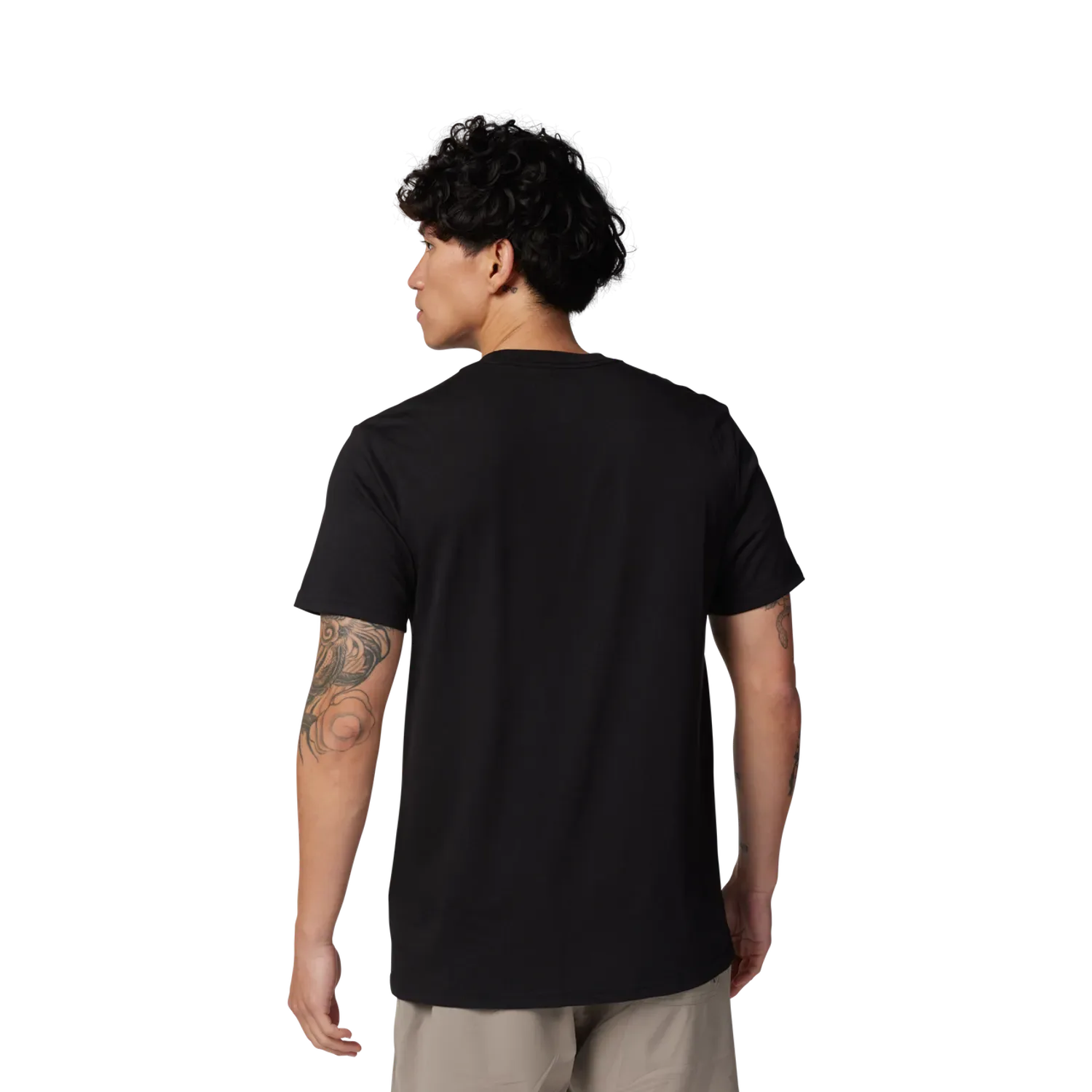 Model trägt ein schwarzes Funktions-T-Shirt Non Stop, Rückansicht, neutraler Hintergrund.