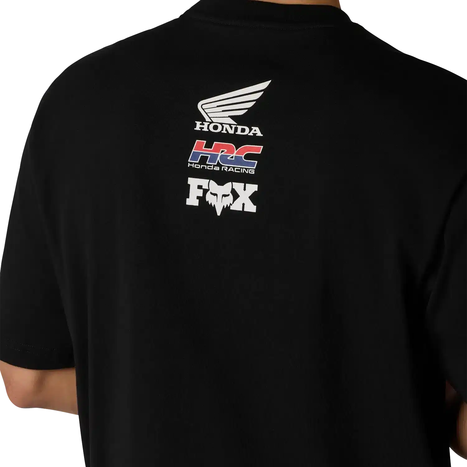 Rückenansicht eines schwarzen Oversized T-Shirts mit Honda, HRC und Fox Logos als farbige und weiße Drucke oben auf dem Rücken.