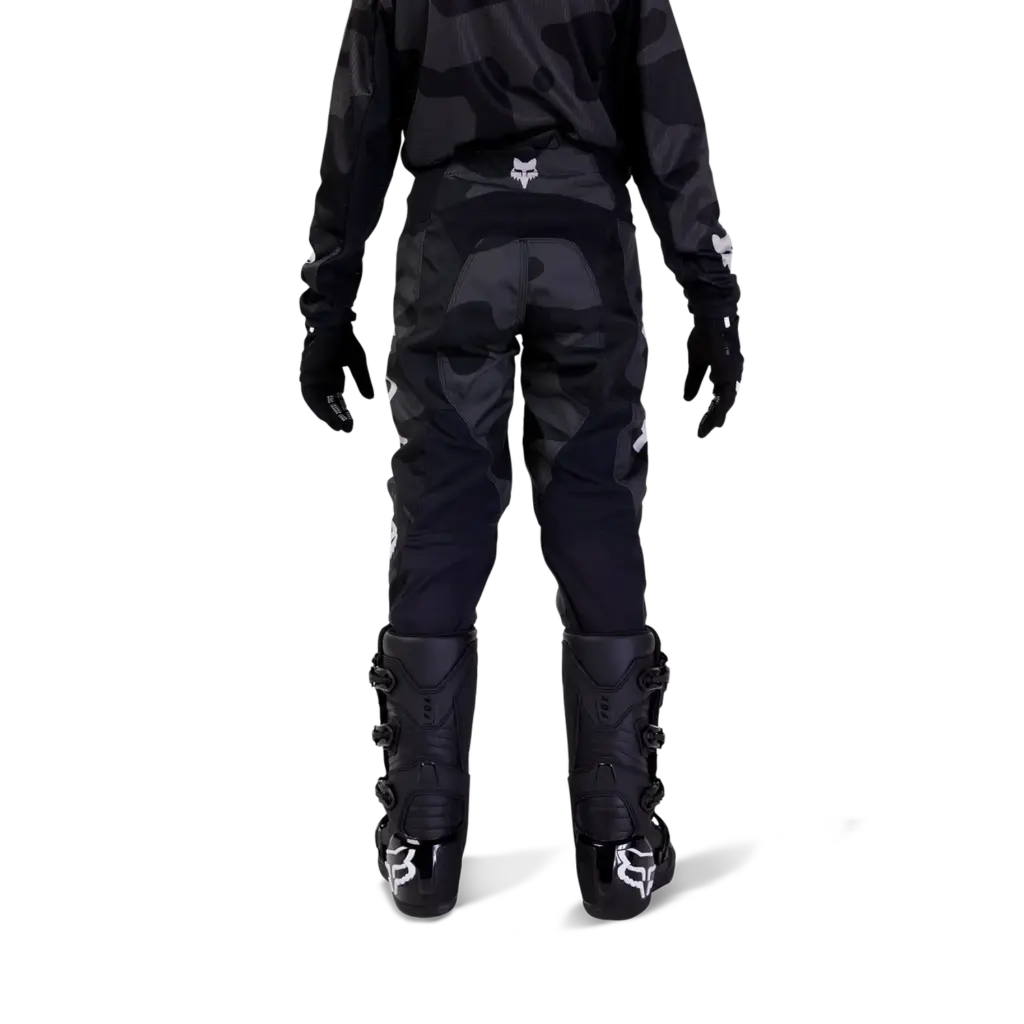 Rückansicht der Fox Racing 180 Bnkr Jugend Crosshose in Schwarz, getragen von jugendlichem Fahrer