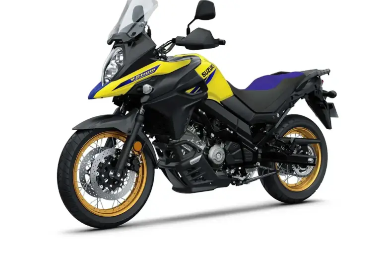 Suzuki V-Strom 650XT Touring Edition Motorrad in Gelb-Schwarz mit goldenen Felgen, seitlich fotografiert.