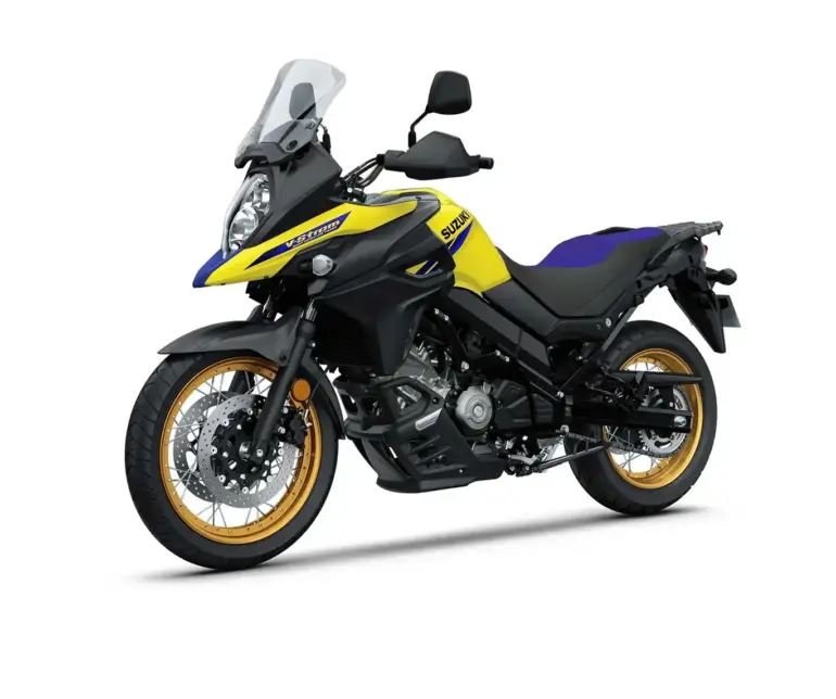 Suzuki V-Strom 650XT Touring Edition Motorrad in Gelb-Schwarz mit goldenen Felgen, seitlich fotografiert.