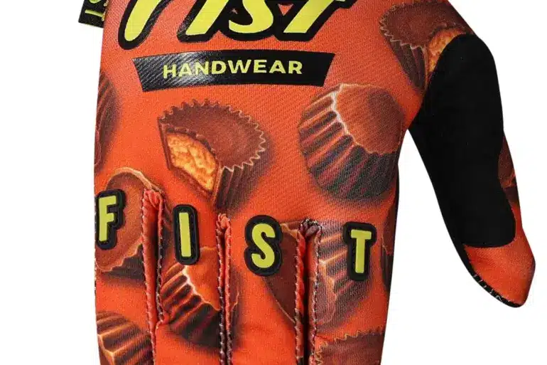 FIST Handwear Handschuh in Orange mit Schokoladenmotiv und Logo, ideal für Motocross und MTB