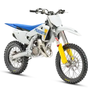 Motocross-Motorrad Husqvarna TC 85 17/14 in Seitenansicht vor weißem Hintergrund