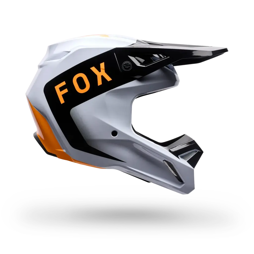 Motocross-Helm von Fox Racing in den Farben Schwarz, Weiß und Orange im Seitenprofil