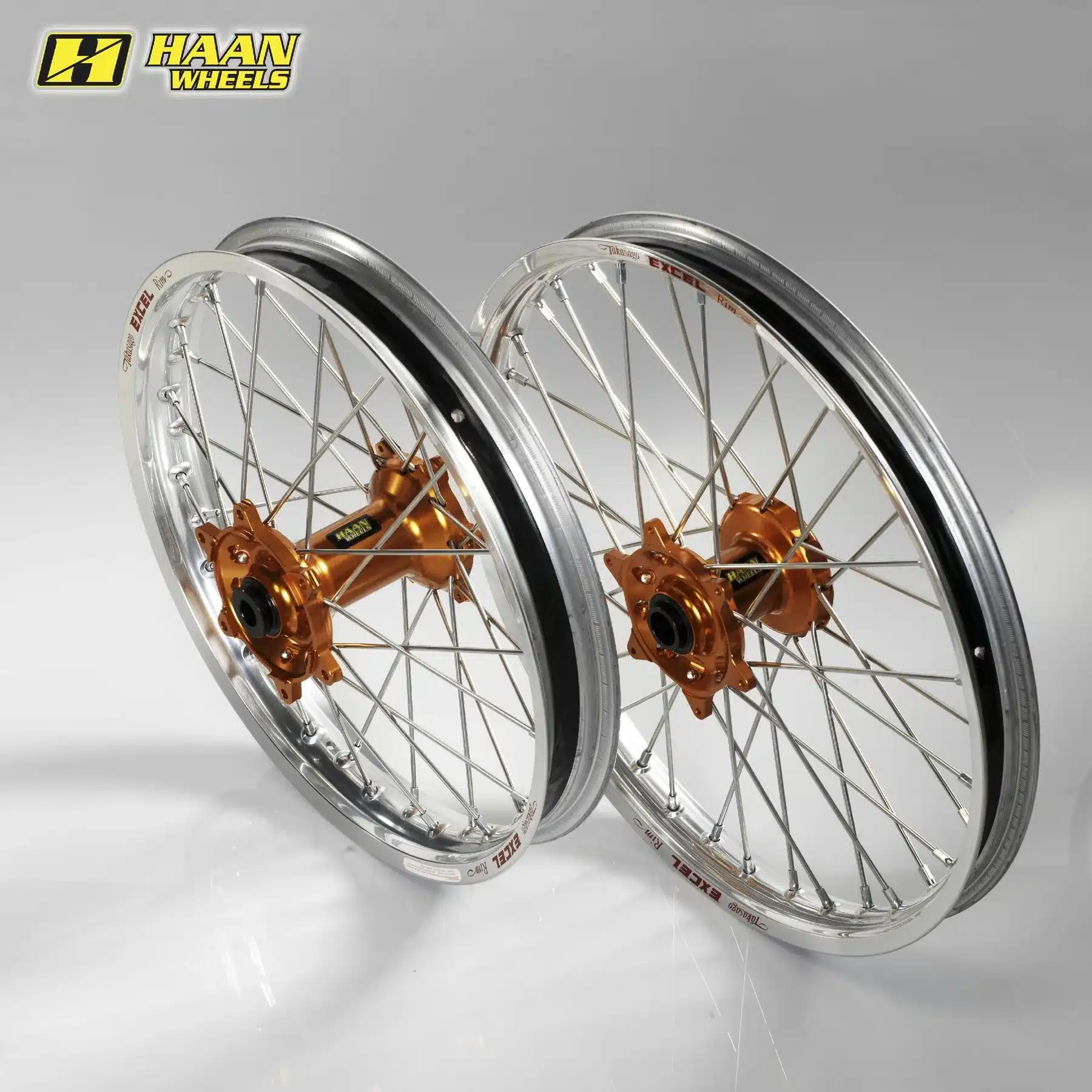 Kompletter Radsatz mit silbernen Excel-Felgen, Edelstahlspeichen und orange eloxierter CNC-Nabe für KTM Offroad-Motorräder