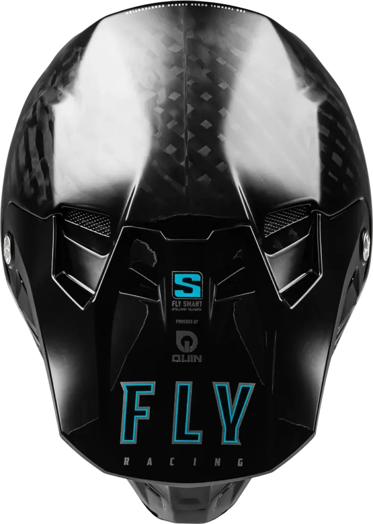 Oberansicht eines schwarzen Fly Racing Helms mit Carbon-Struktur und integrierten Belüftungsöffnungen