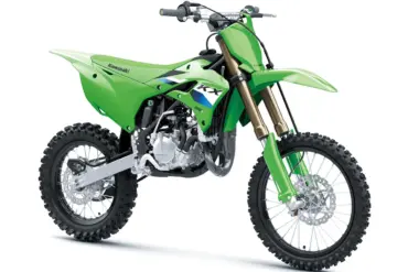 Kawasaki KX85 L 2027 in Seitenansicht, grünes Motocross-Bike mit großem Vorderrad und Hinterrad.
