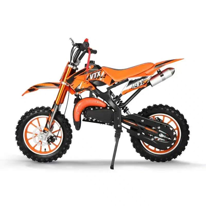 Seitenansicht eines orangefarbenen Valtinsu 49cc Mini-Dirtbikes für Kinder mit grobstolligen Reifen.